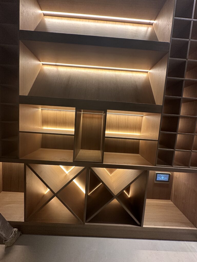 Antique brushed bronze wine racking with integrated LED lighting