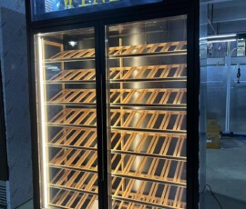 Bespoke wine display cabinet with illuminated WINES light box header and full-height wood racking